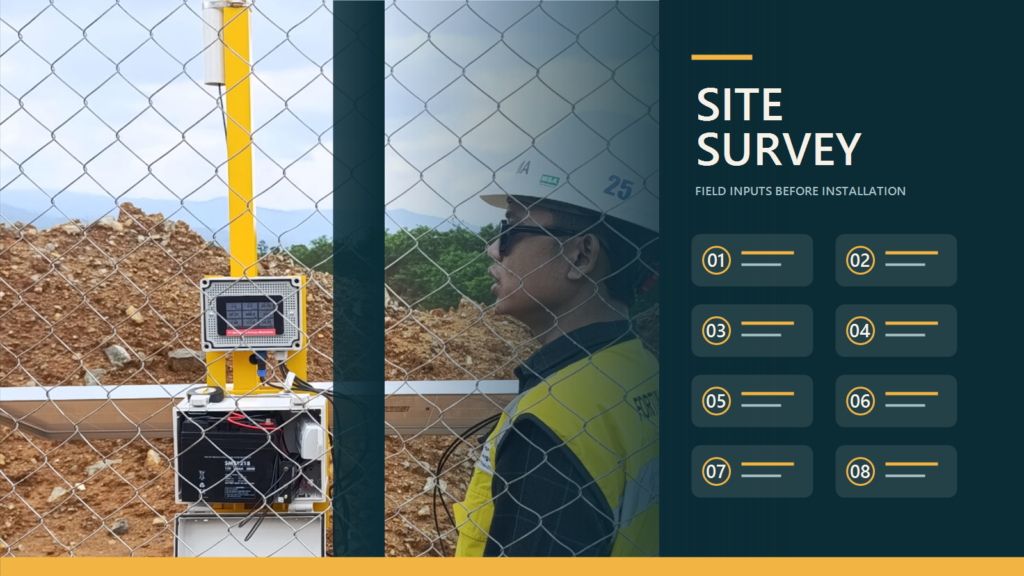 Field team reviewing a monitoring system installation with site survey markers